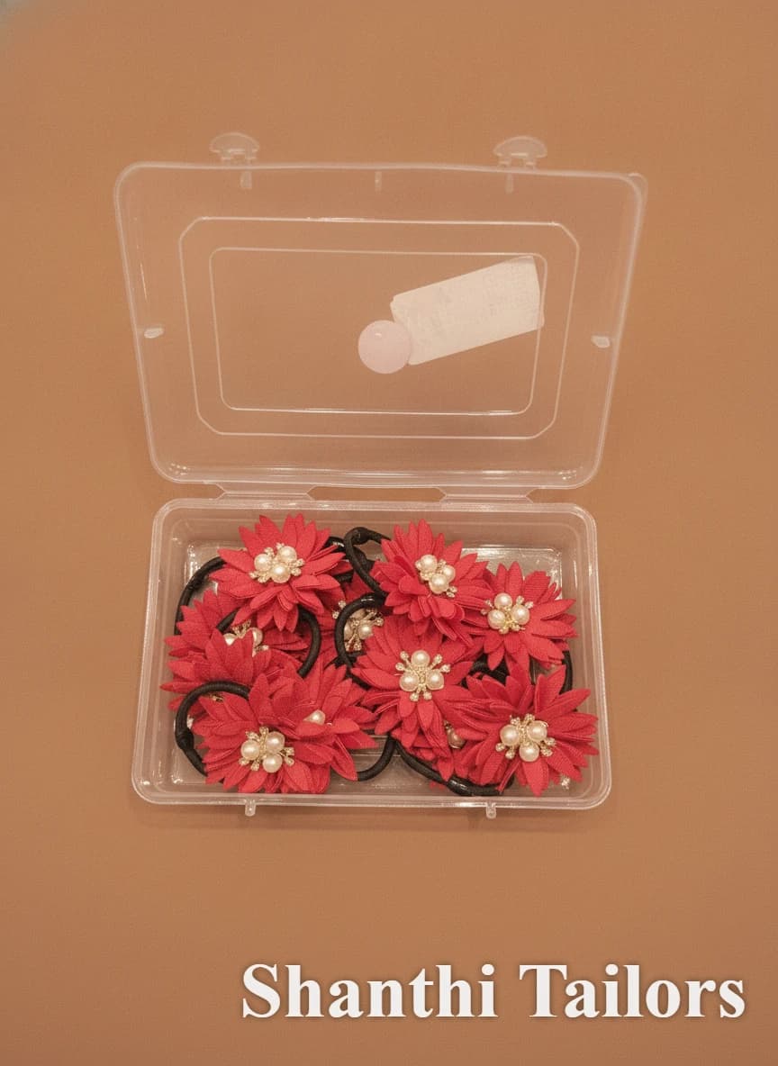 Shanthitailors Flower Rubber Band set: Red fabric flowers with pearl centers in a clear box.