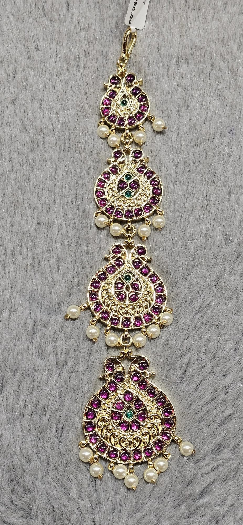 Swan Chutty Tikka (812325) in copper with ruby-like stones, emerald-like accents, and pearls.