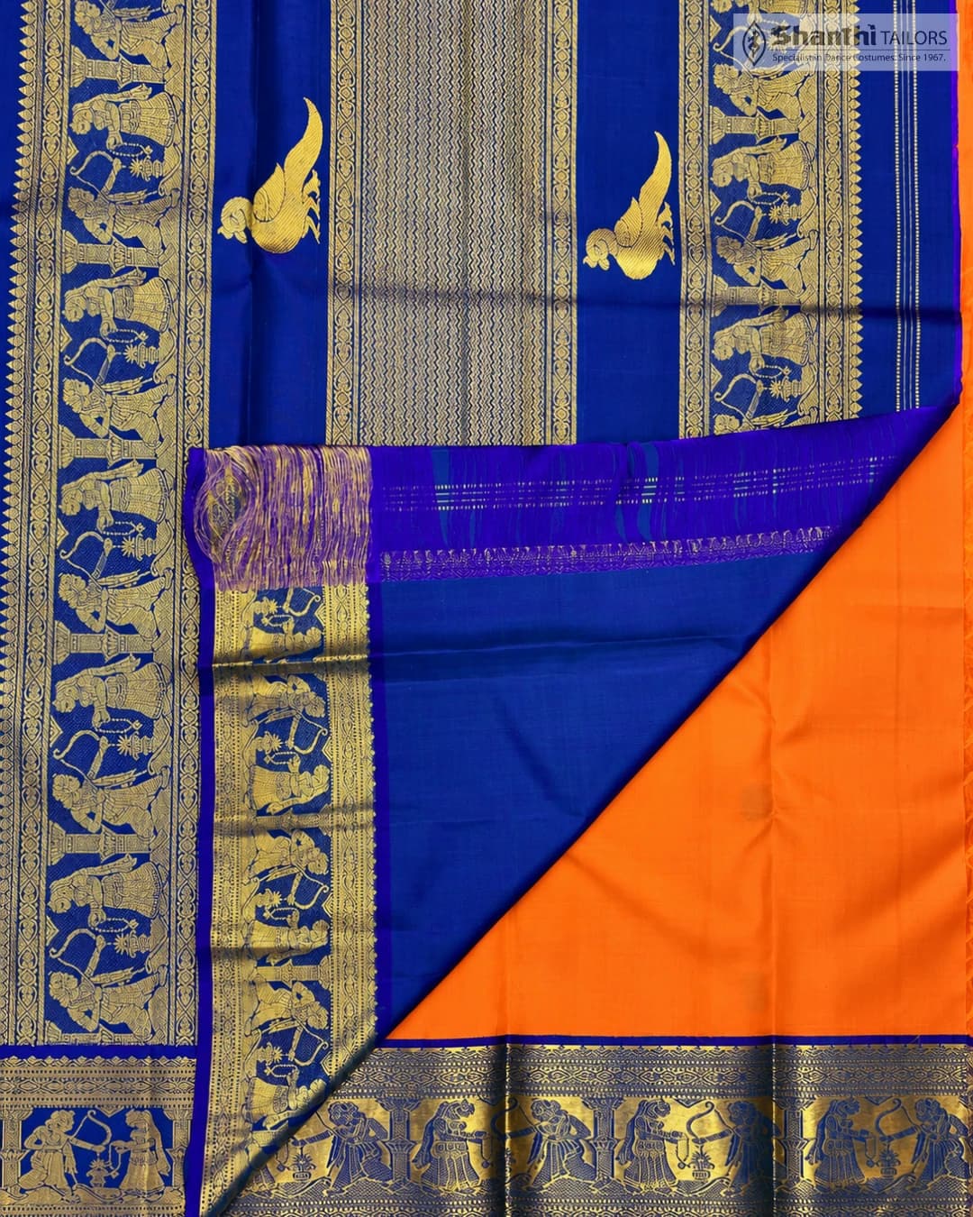 Pure Kanchipuram Silk Saree: Orange body with royal blue border & pallu, intricate gold zari motifs.