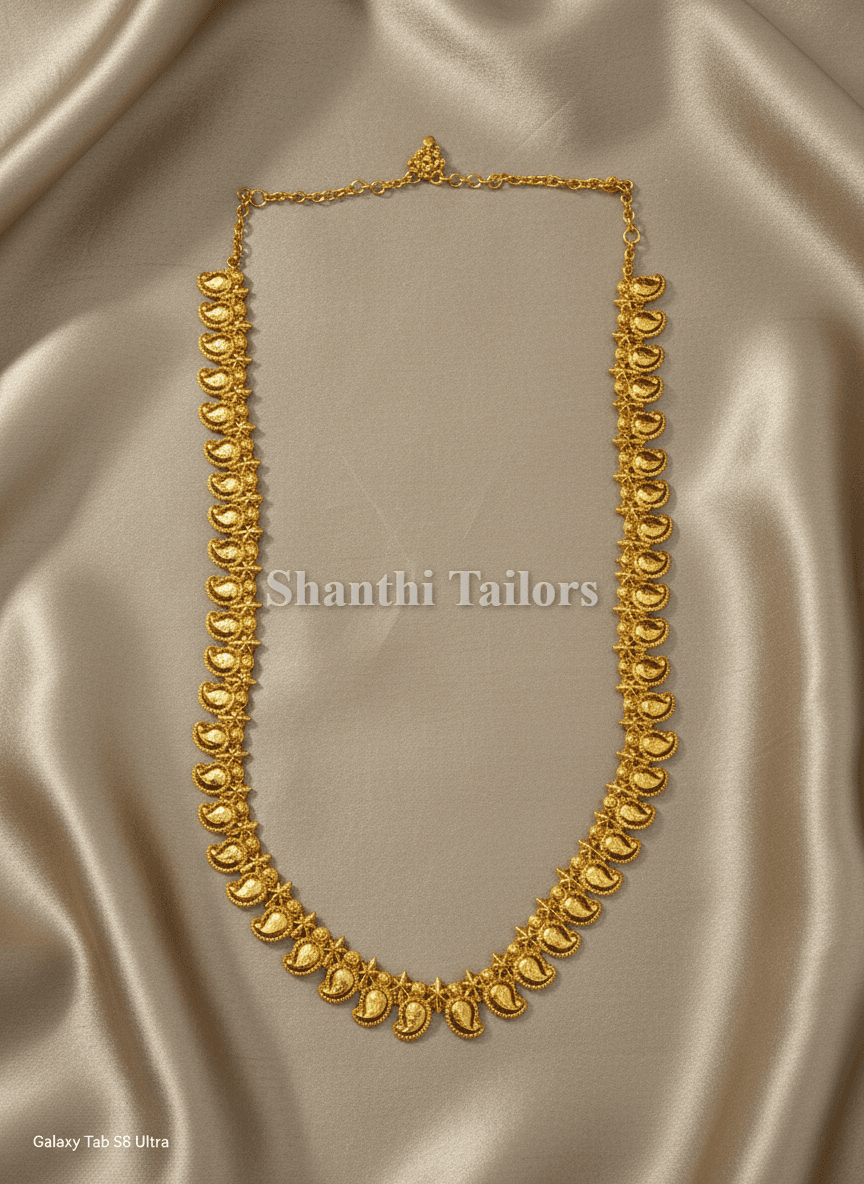 Close-up: silver base gold leaf Mango Haram, temple jewellery necklace, Bharatanatyam jewellery set