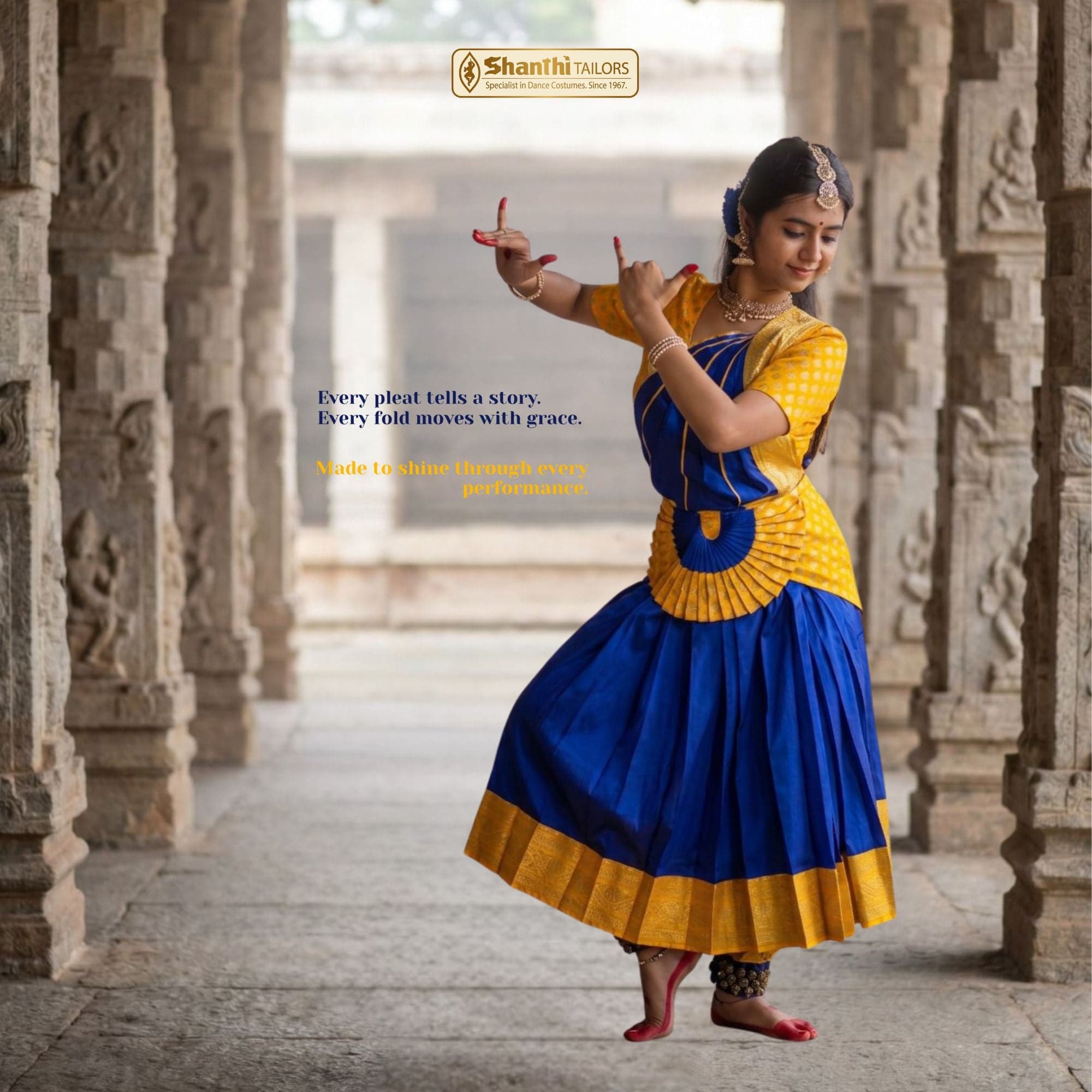 Bharatanatyam Arangetram costume back view. Blue skirt, gold blouse, pleated fan. Dance costume.