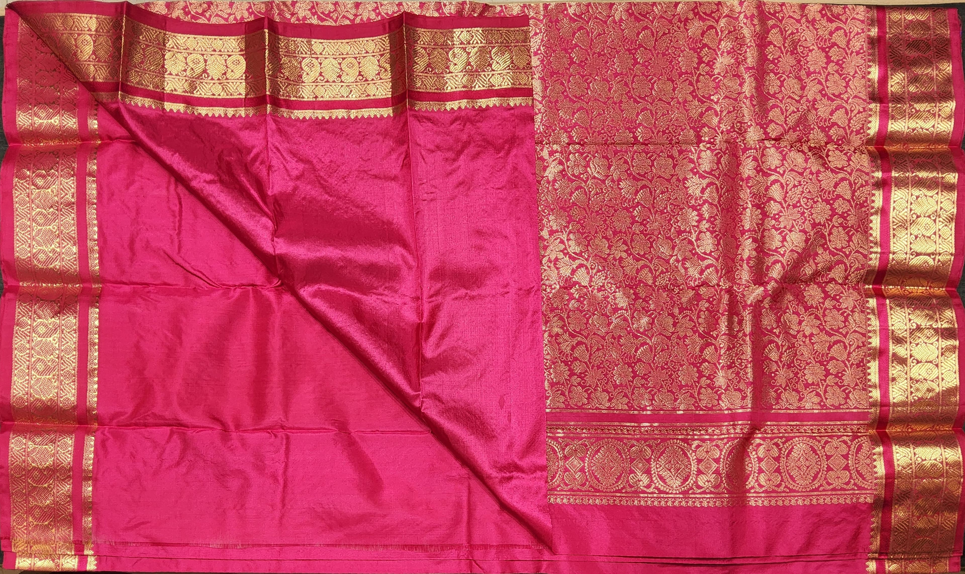 Dharmavaram sarees: Close-up of the golden peacock zari border on this pink authentic silk saree.