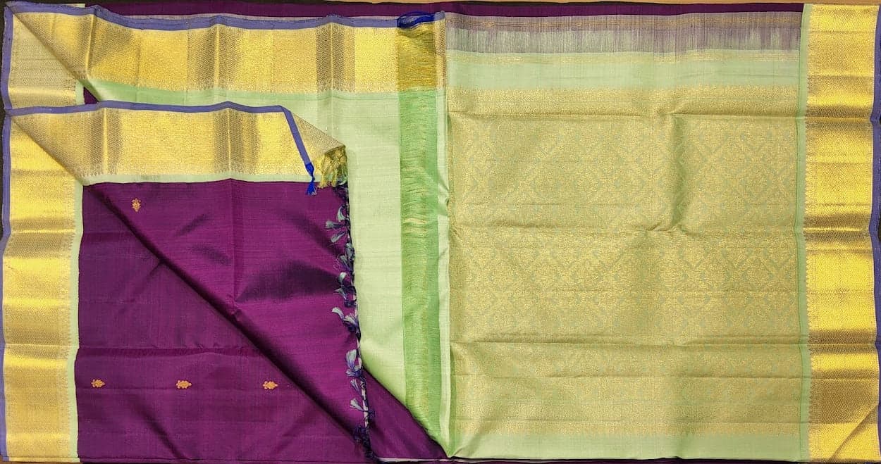 Dharmavaram sarees style: Purple Kanchipuram authentic silk saree with pista pallu detail.