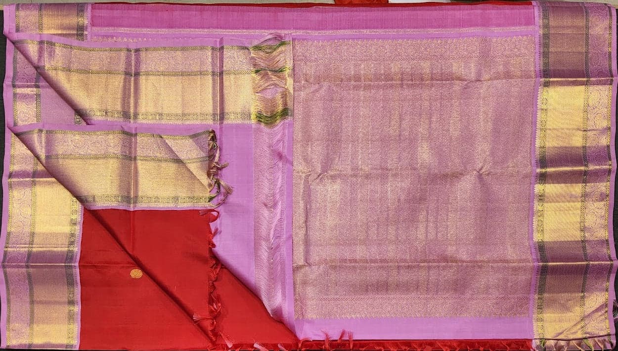 Authentic silk Kanchipuram saree pallu detailing, red and gold zari.