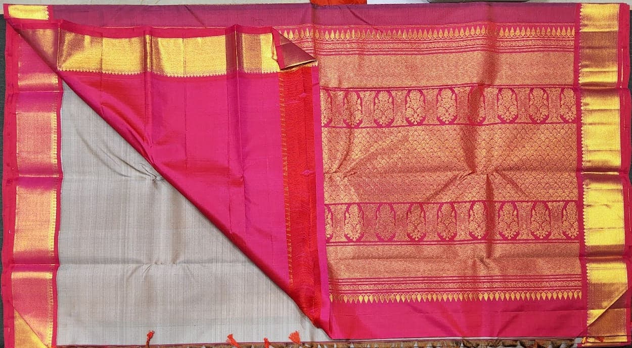 Drape of Grey Kanchipuram authentic silk saree with rani pink border, perfect for dance.