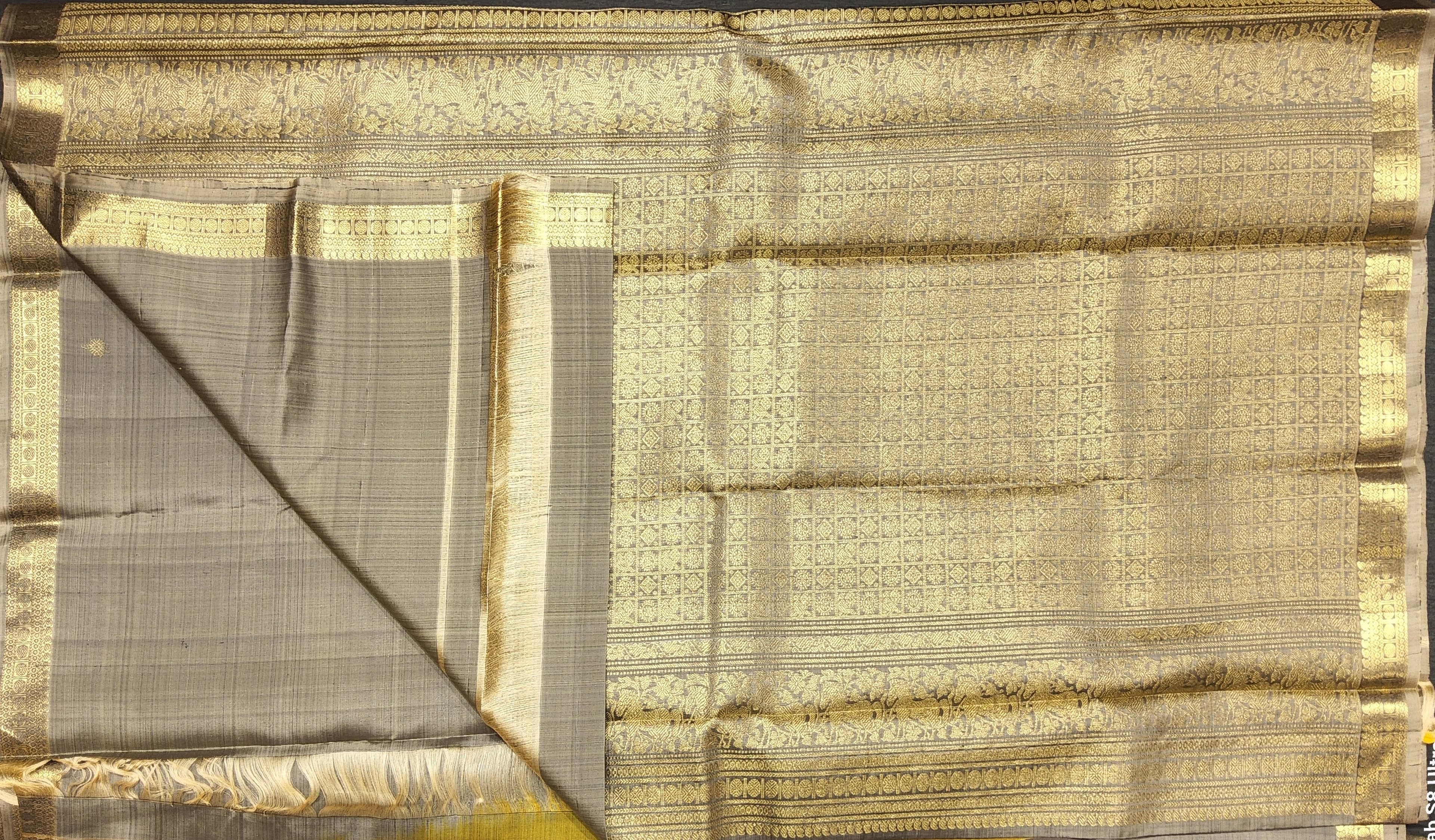 Kanchipuram authentic silk saree pallu design; grey and gold zari for dance performance.