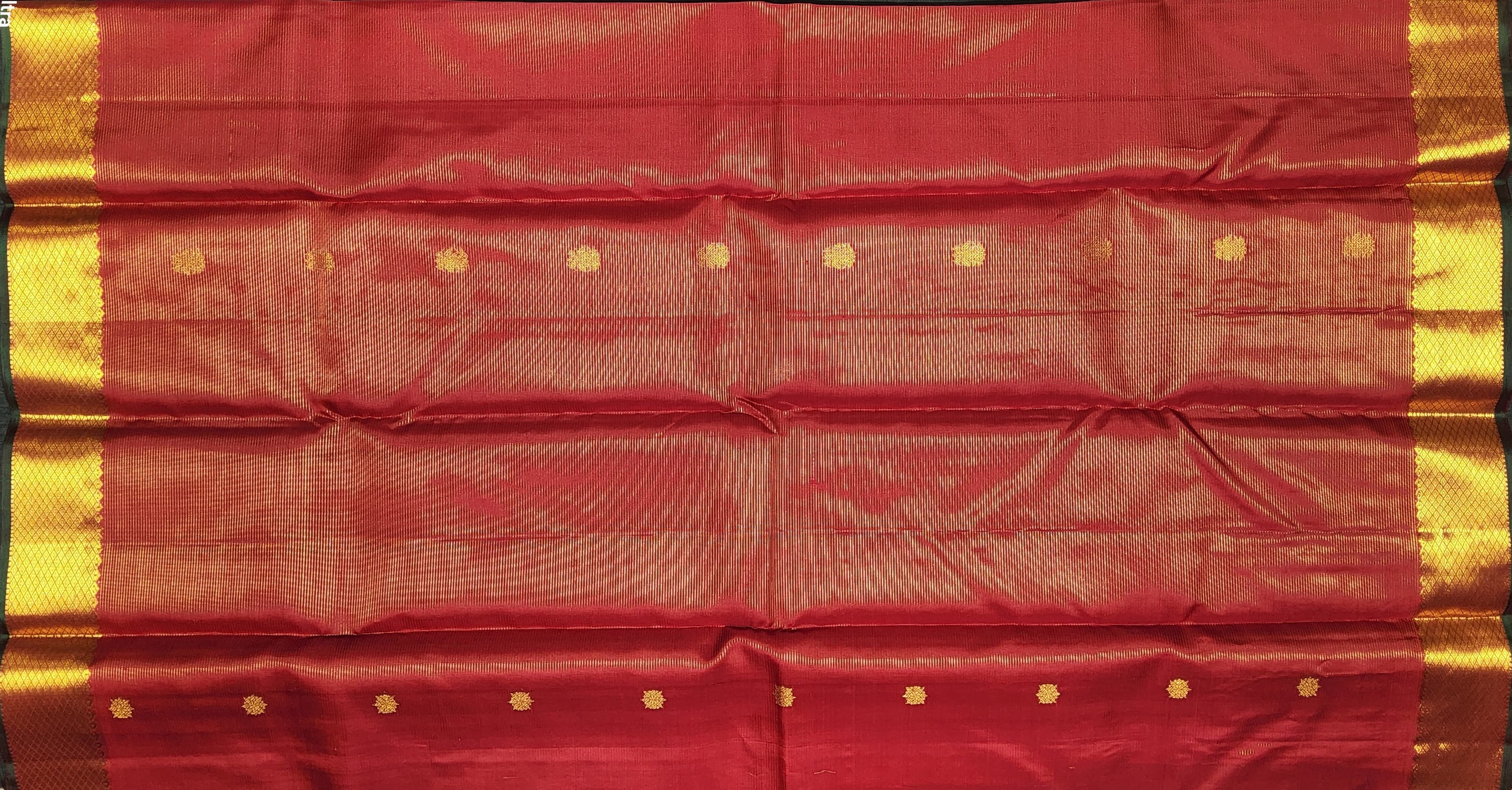 Close-up of red and gold Kanchipuram authentic silk saree, perfect for arangetram.