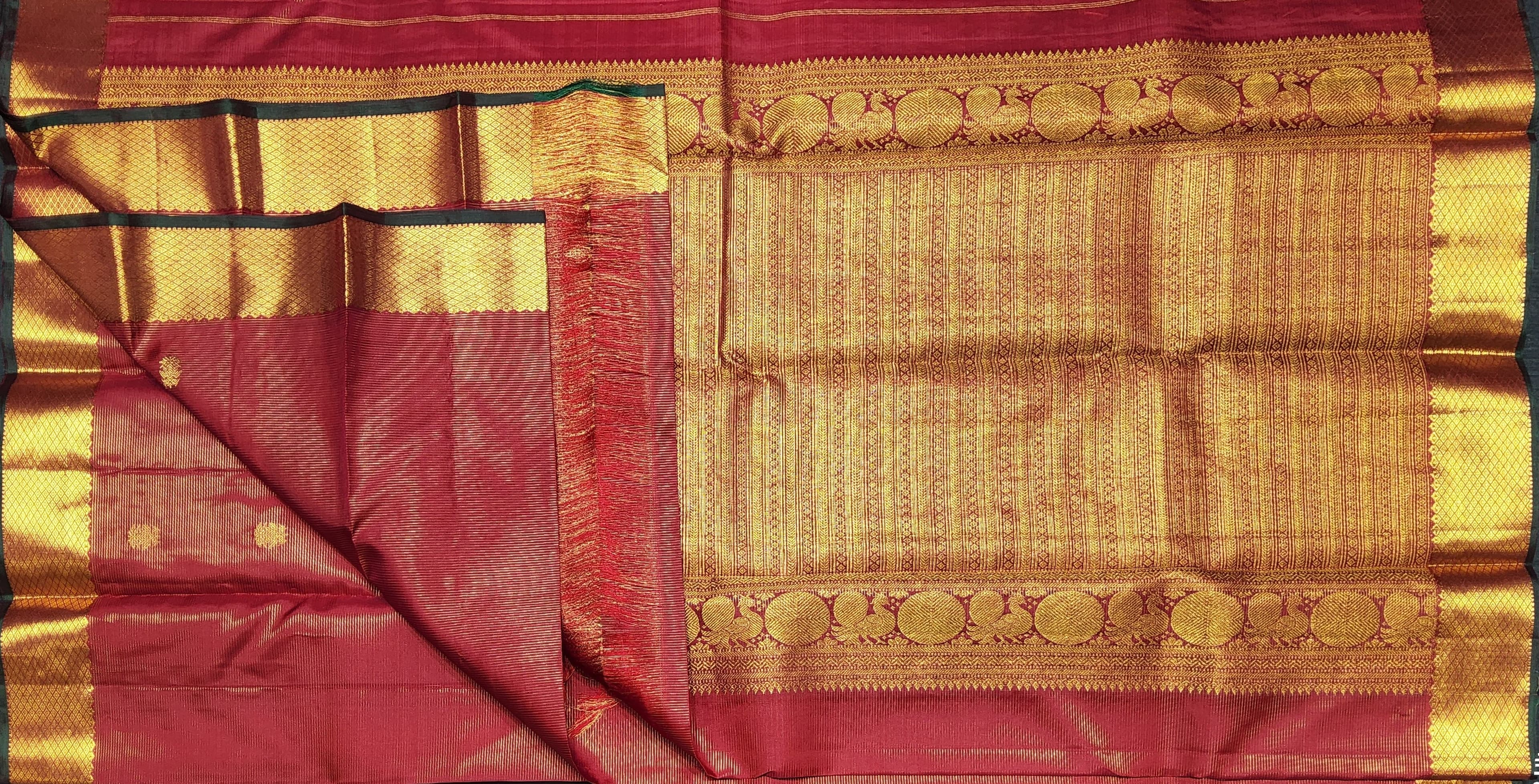 Red and gold Kanchipuram authentic silk saree pallu, suitable for arangetram meaning.