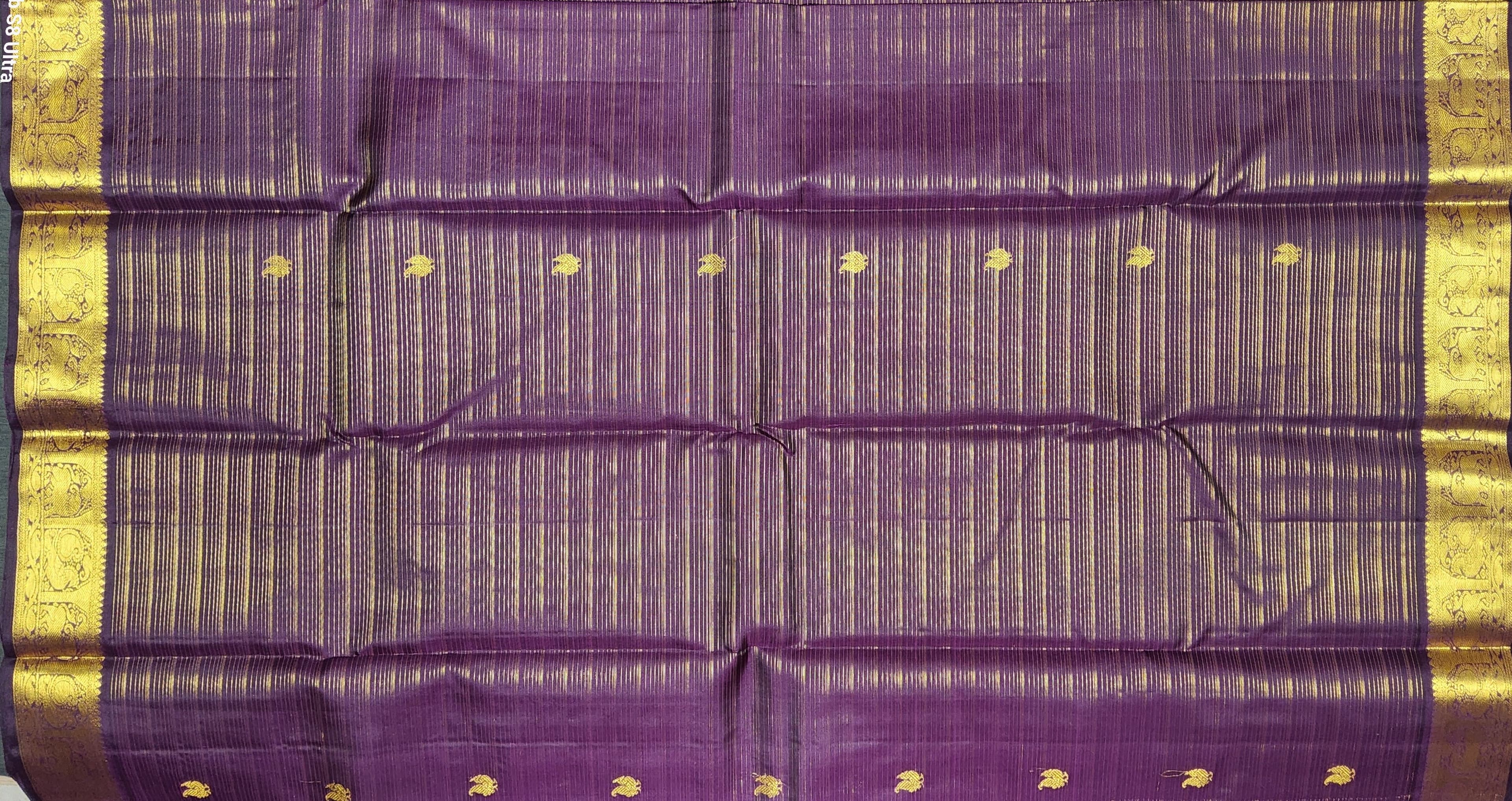 Close-up of gold zari work on Kanchipuram authentic silk saree; Arangetram, Bharatanatyam.