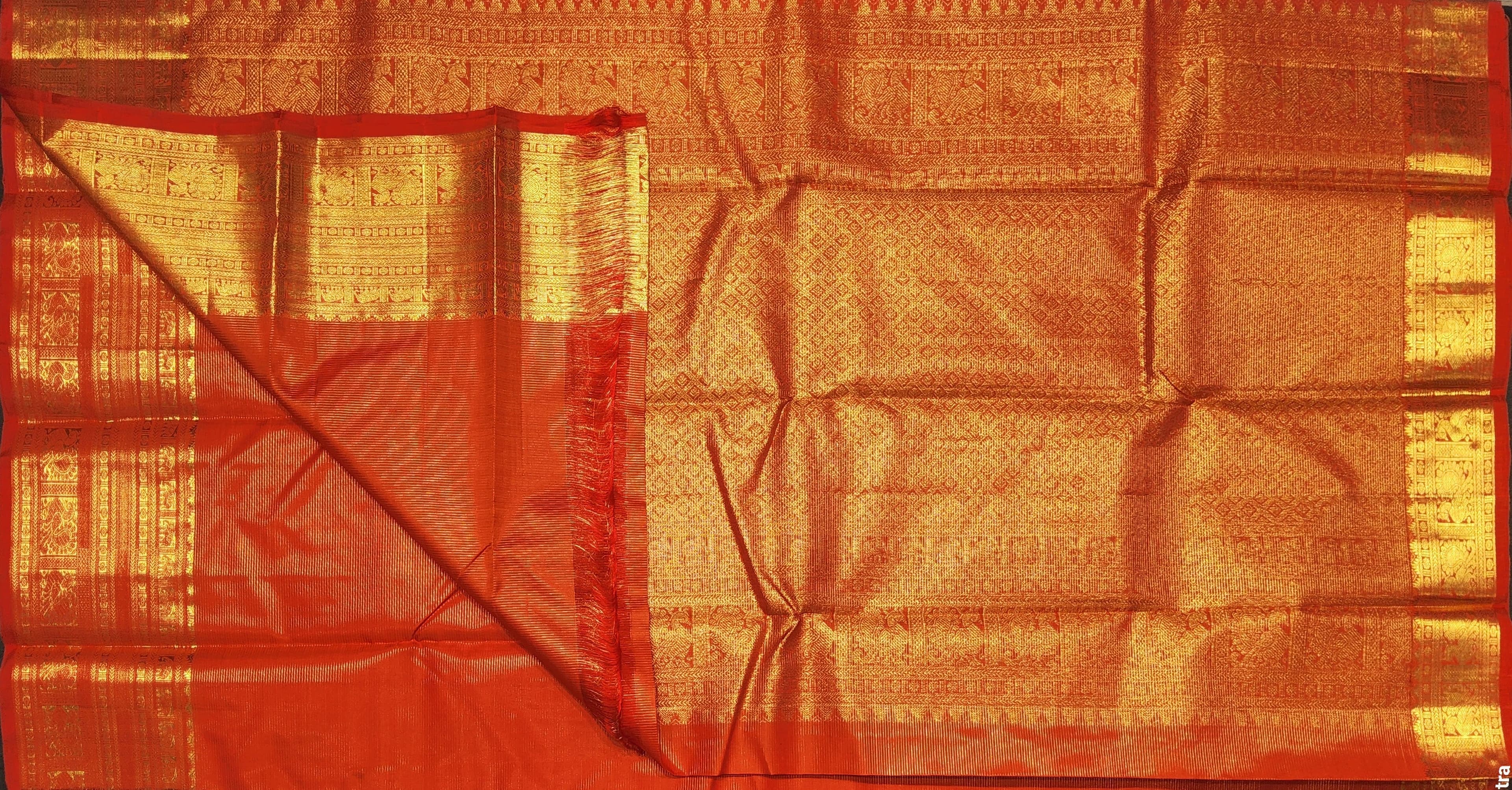 Orange Kanchipuram authentic silk saree for Bharatanatyam practice, gold border.