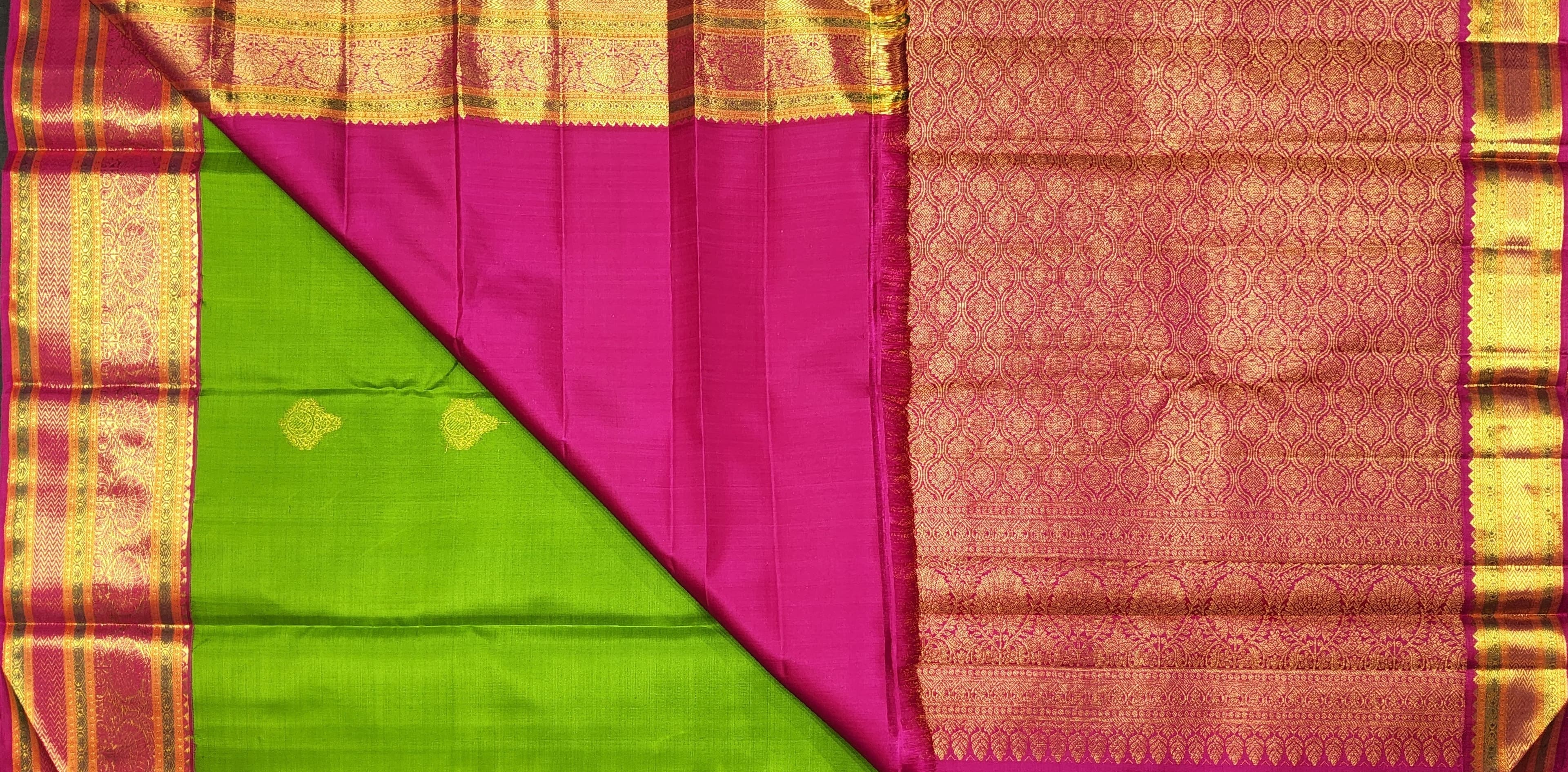 Green Kanchipuram silk saree pallu design. Perfect for arangetram meaning, showcasing intricate gold zari work.