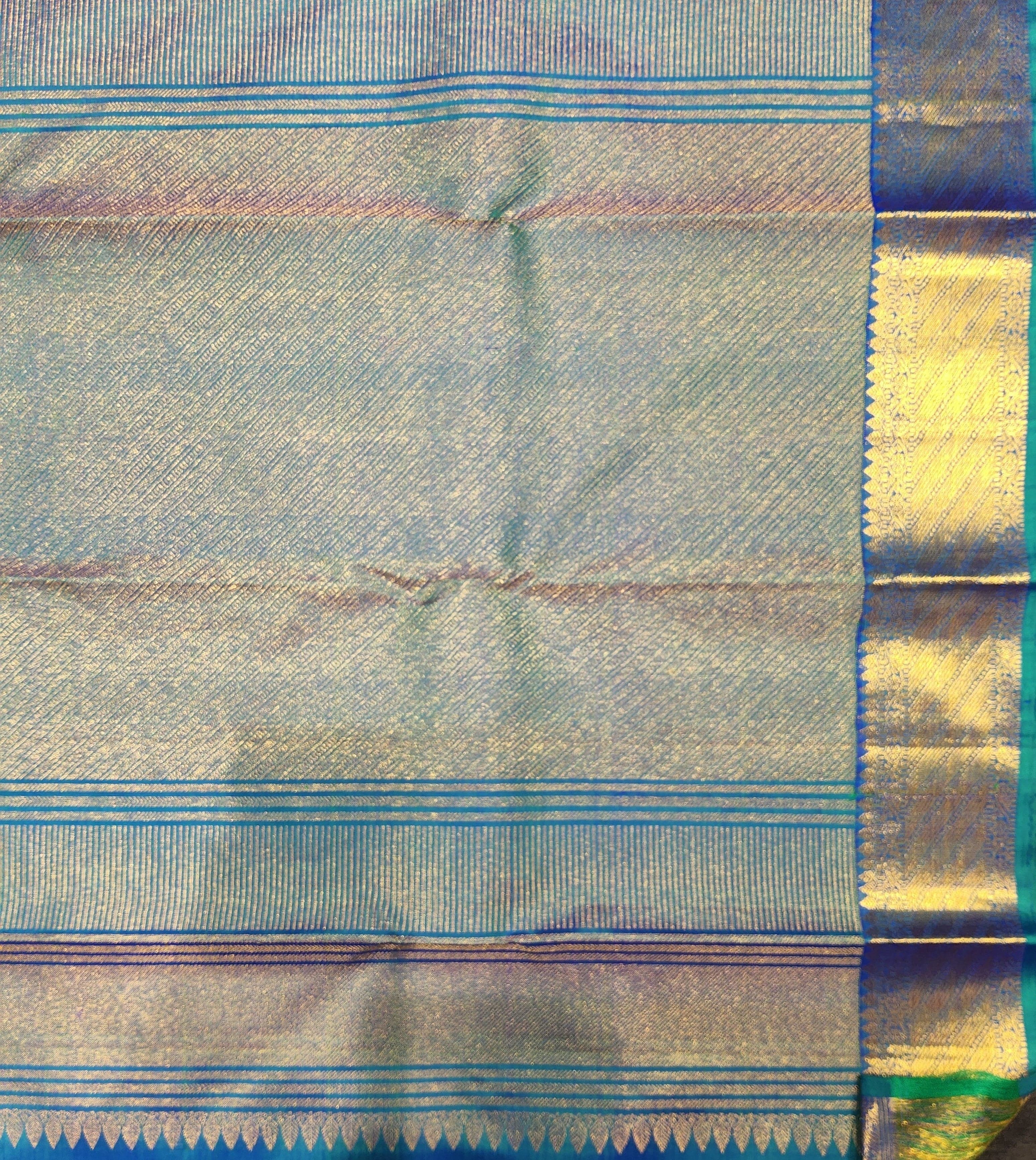 Kanchipuram silk saree: Royal blue and green, gold zari border, arangetram, authentic silk.