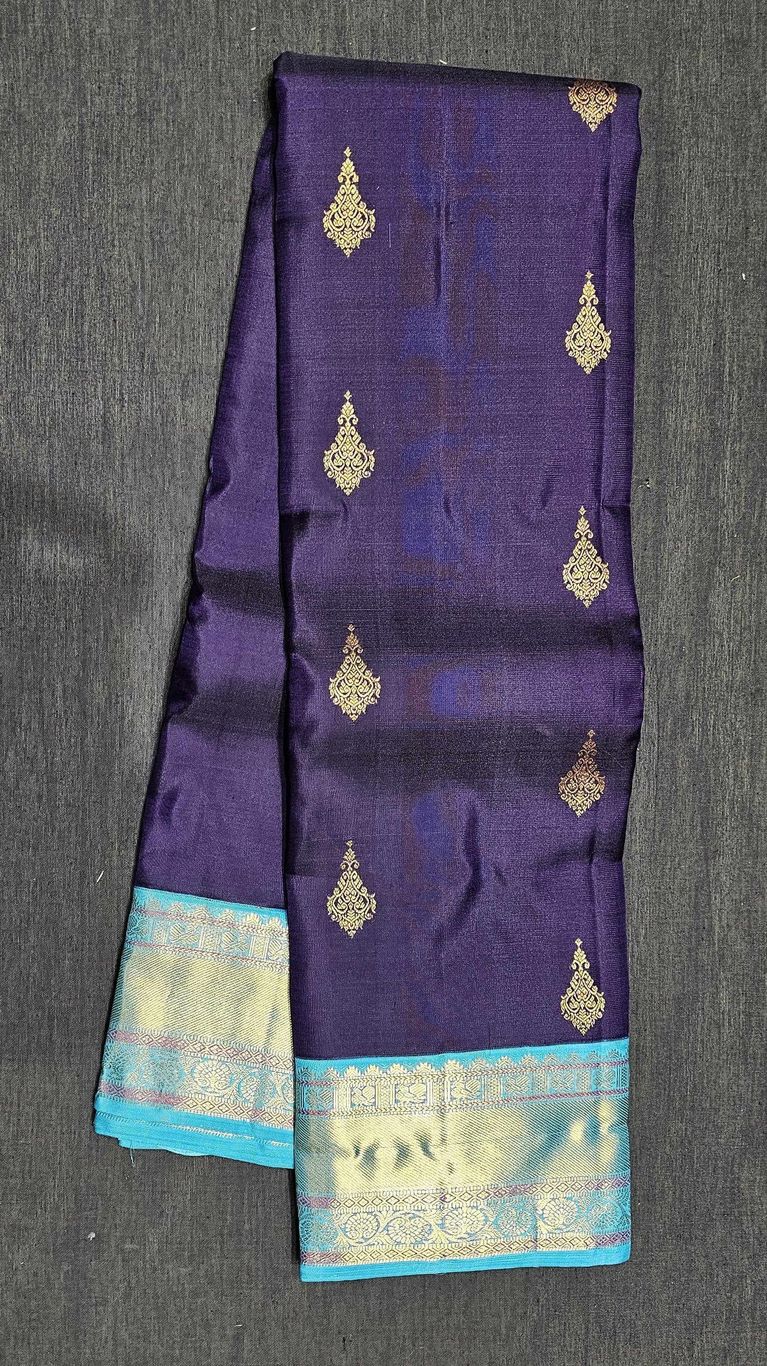 Close-up of Kanchipuram authentic silk saree border. Teal, purple, gold zari. Ideal dance saree.