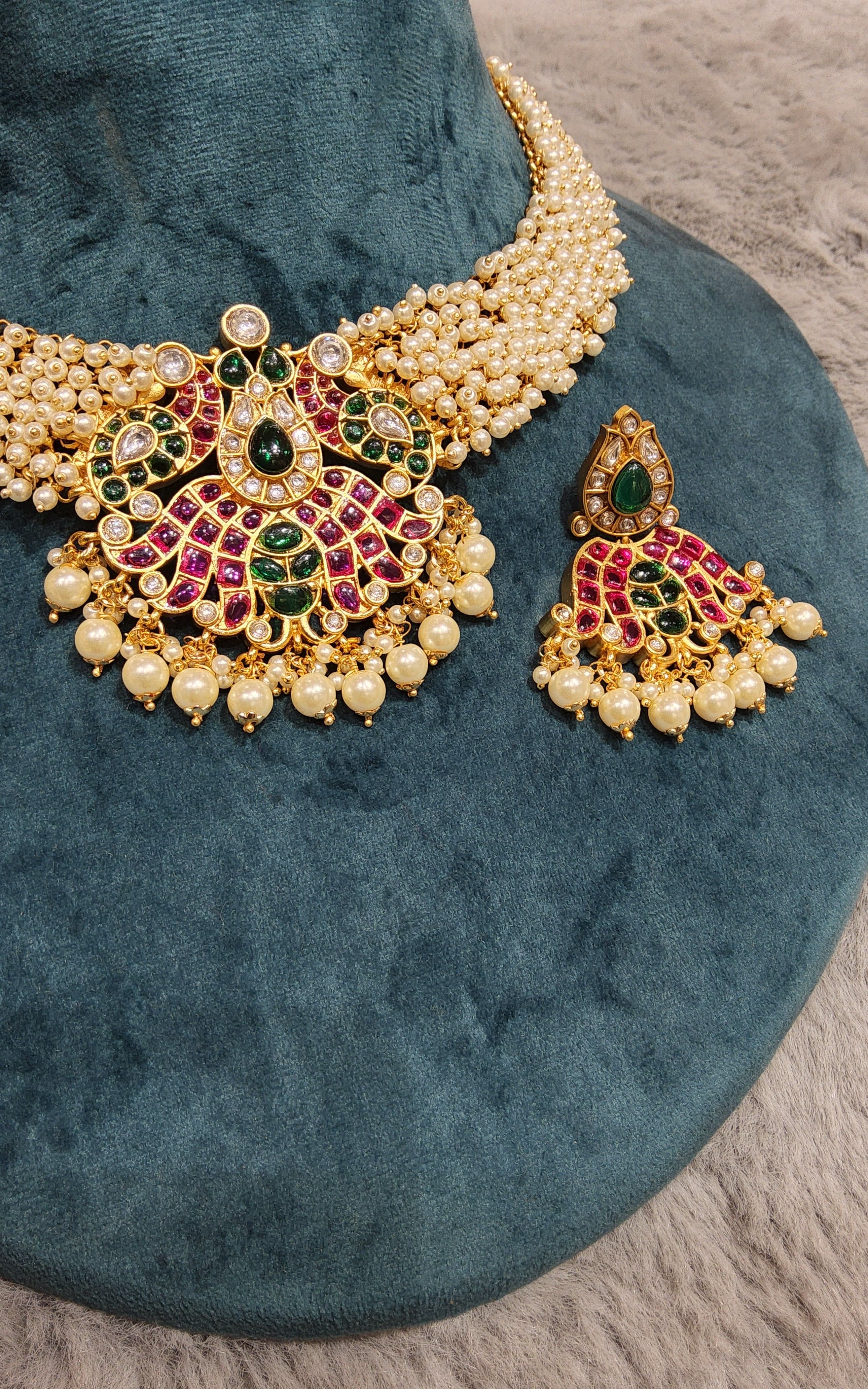 Close-up of Lotus Pearl Necklace, showing lotus detail. Sophisticated pearl jewelry.