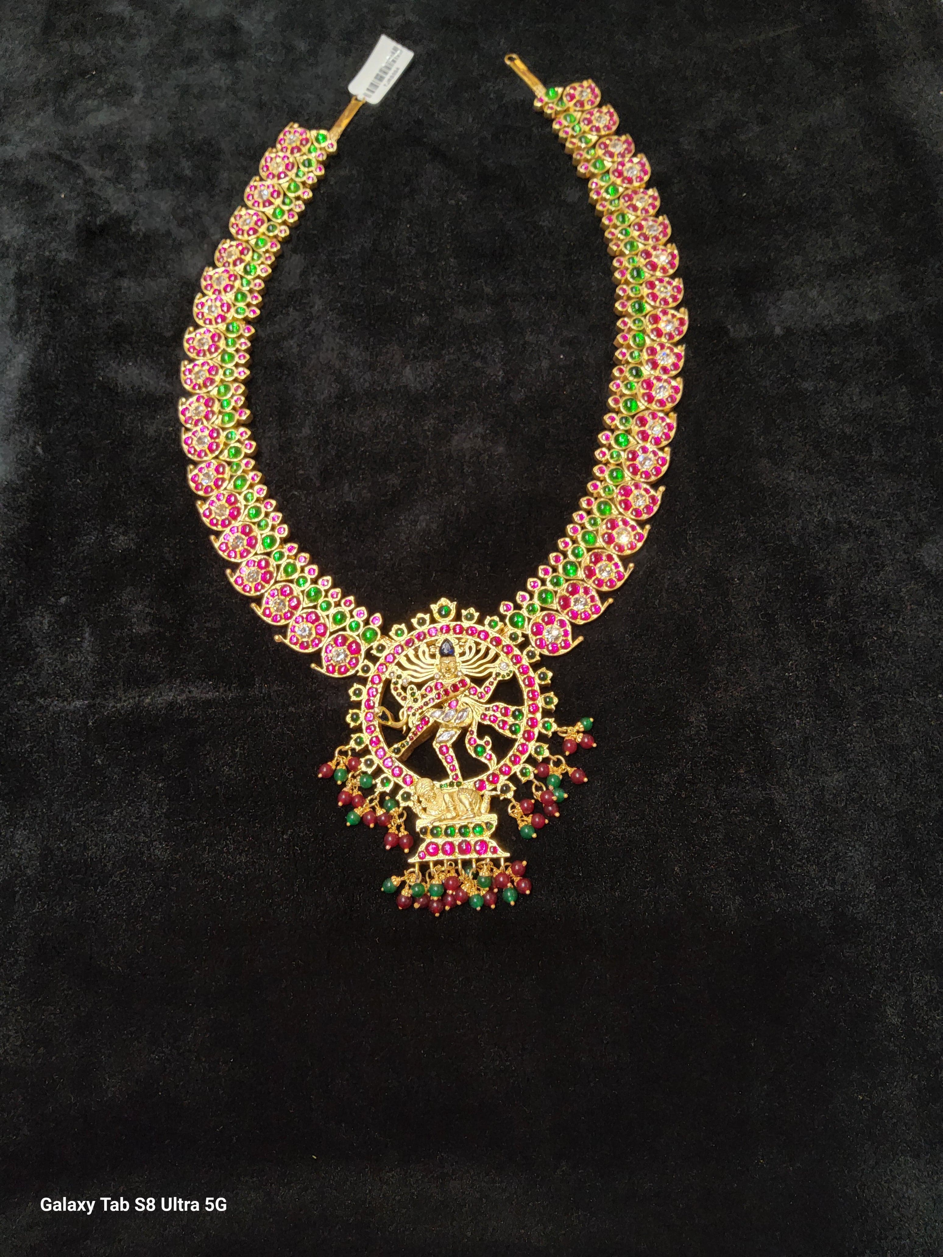 Close-up: Ruby Mango Haram featuring Natarajar. Exquisite temple jewelry details for Bharatnatyam dancers.
