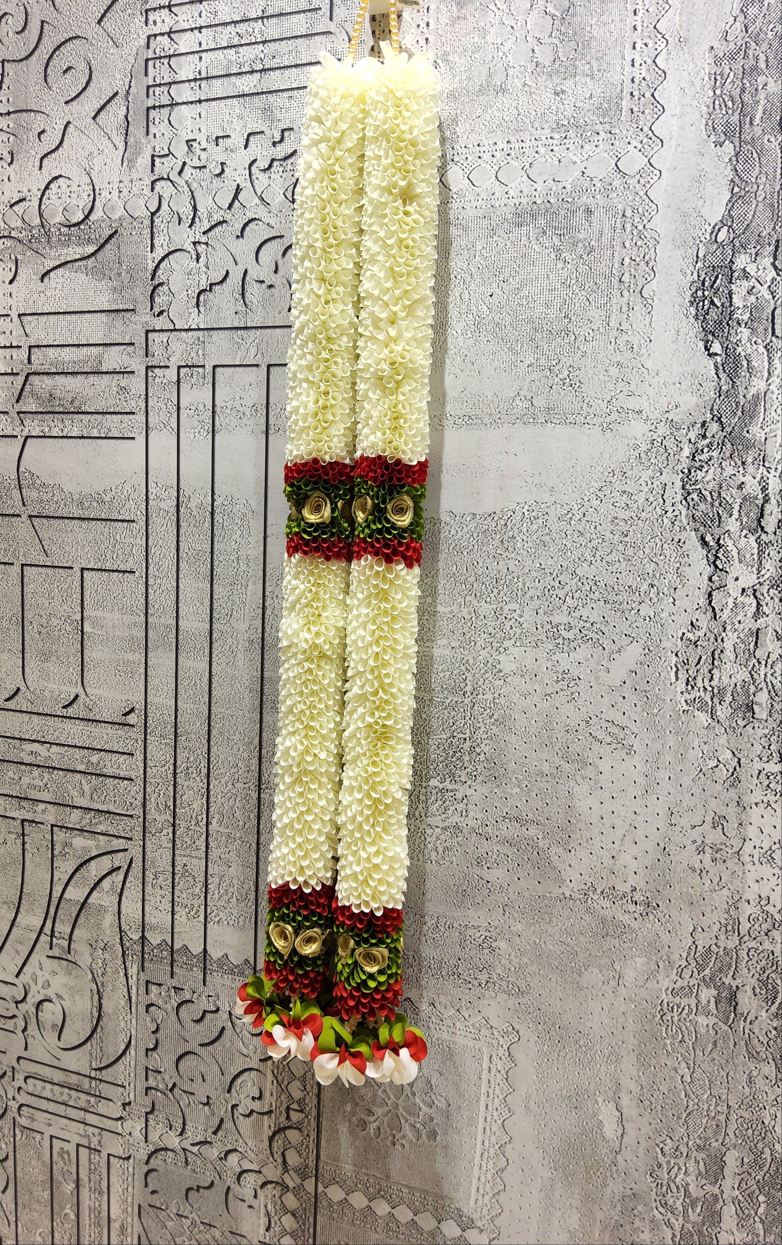Close-up of Andal Mallai cloth garland; Bharatanatyam hair accessories and dance costume adornment.