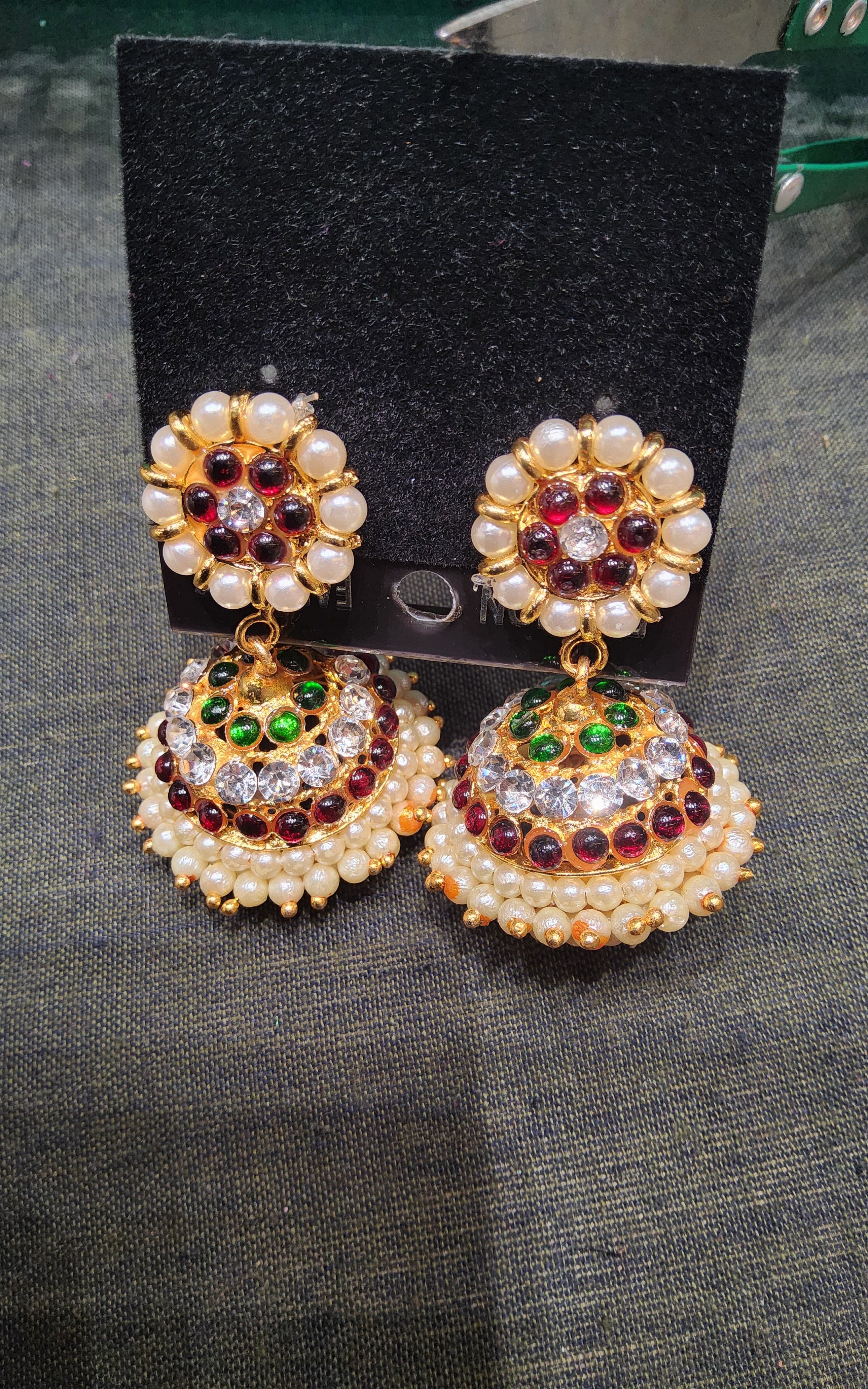 Bharatanatyam jewellery set: Silver base gold leaf jummiki earrings detail.