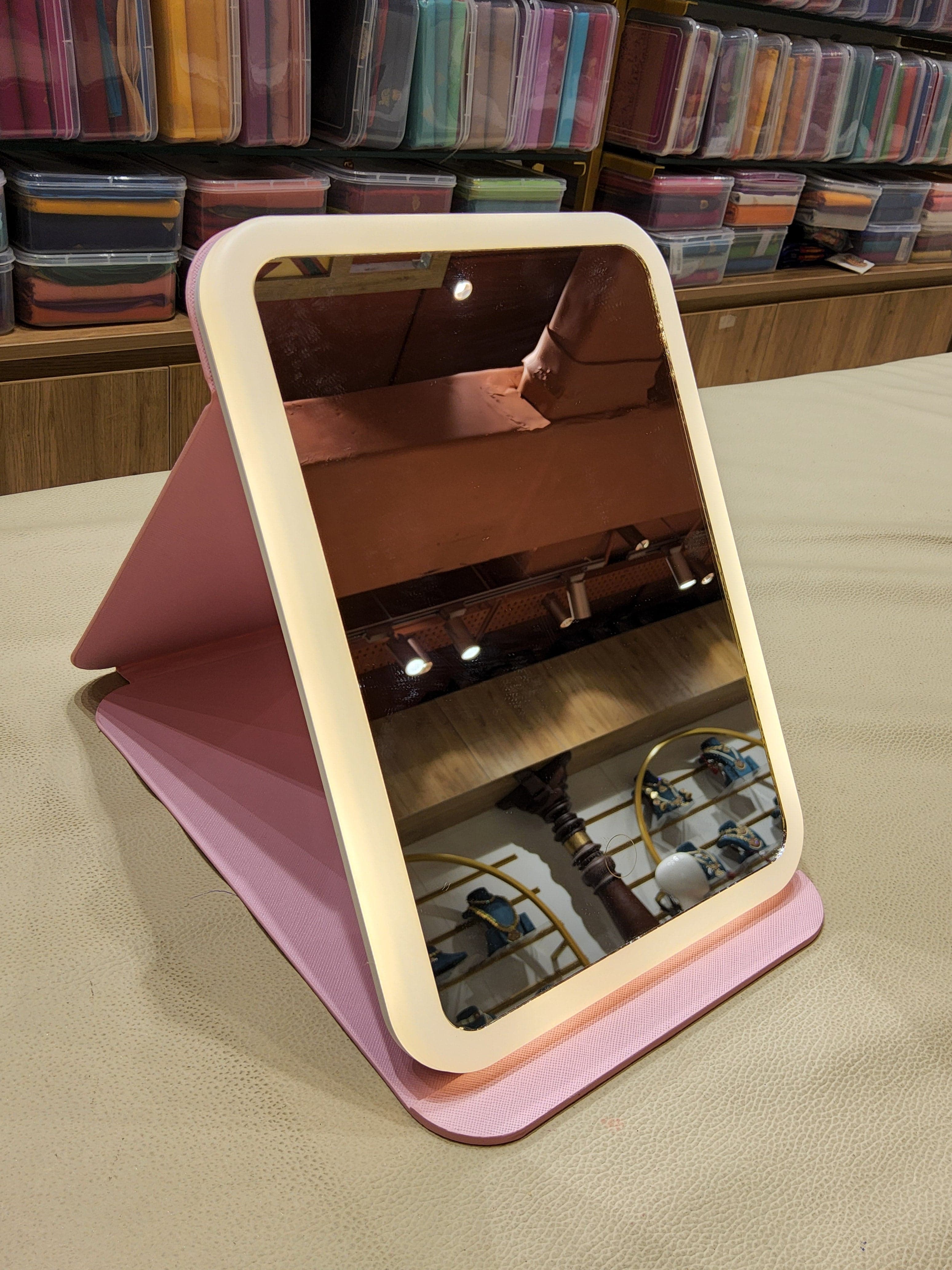 Angled view of Stand Mirror: Reflective surface and adjustable stand for dancers.