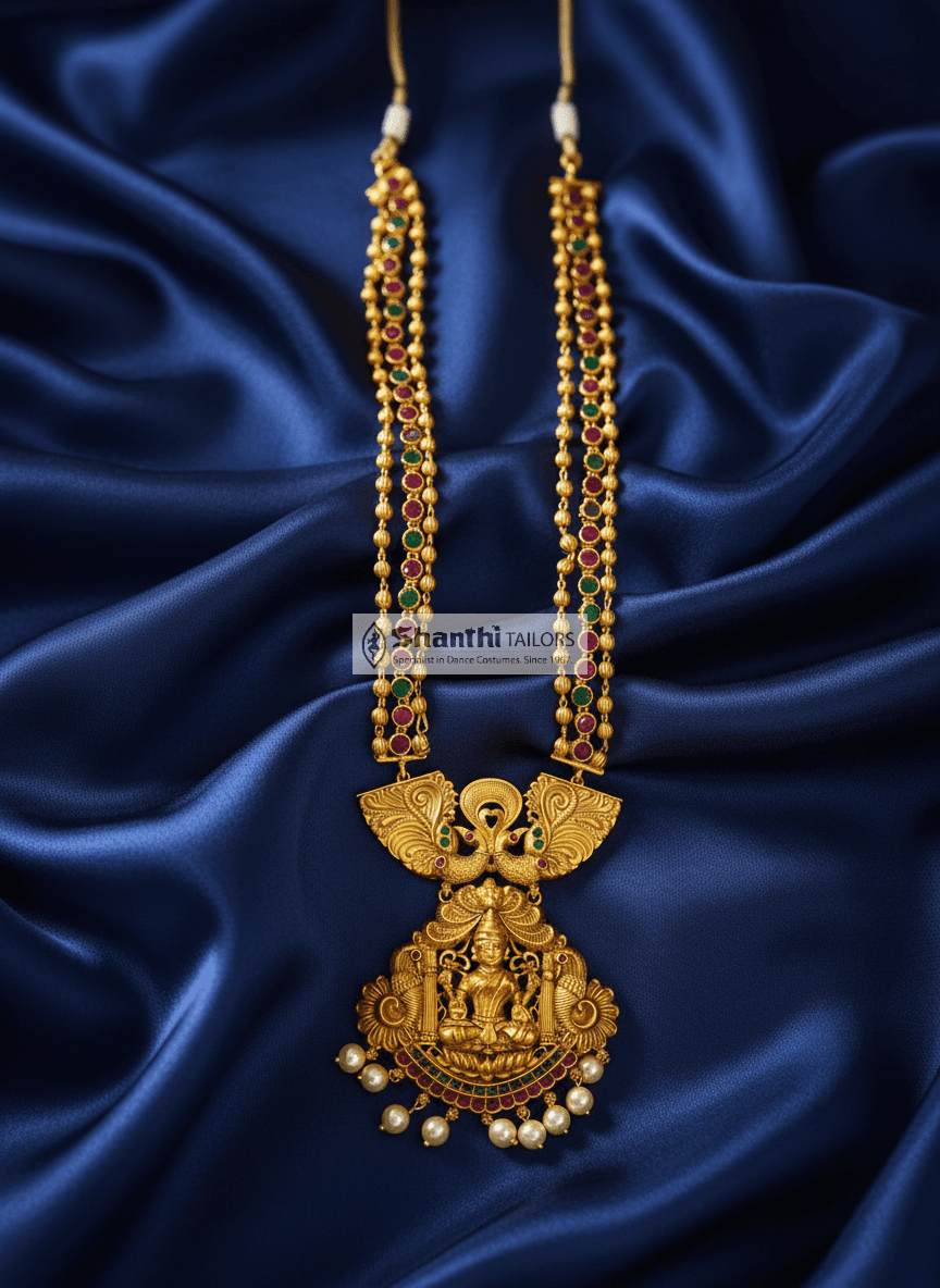 Lakshmi Pendant Gold Haram: Close-up of divine Hindu goddess detail on fashion jewelry