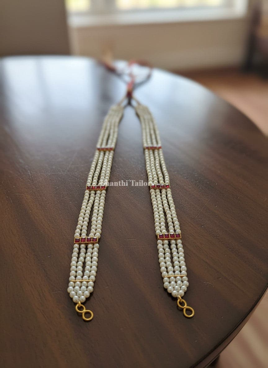 Long kemp haram for Bharatanatyam. Silver base gold leaf temple jewellery. Shanthi Tailors Pvt Ltd.