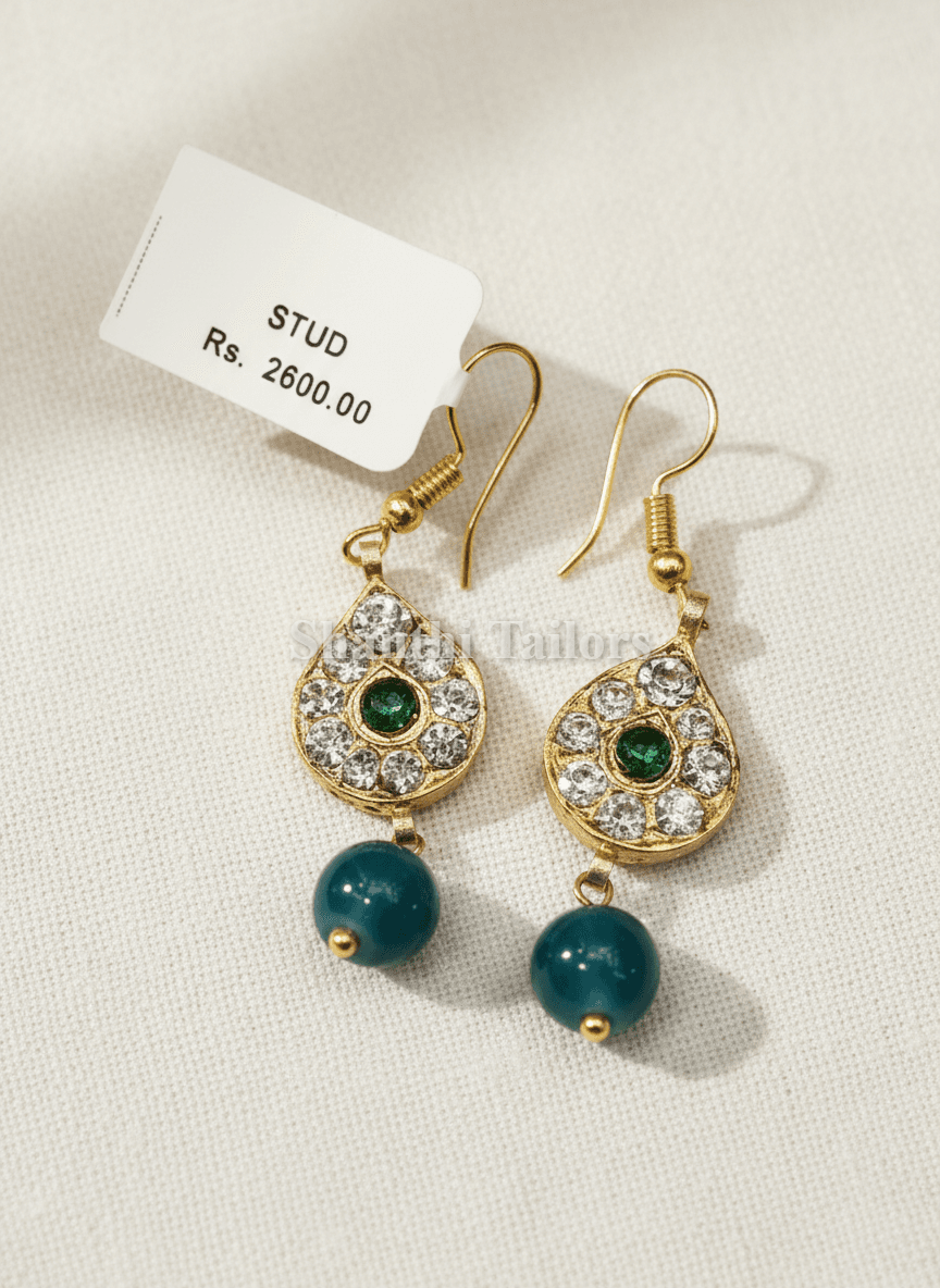 Temple jewellery stud earrings for Bharatanatyam, silver base gold leaf, close up view, kemp details.