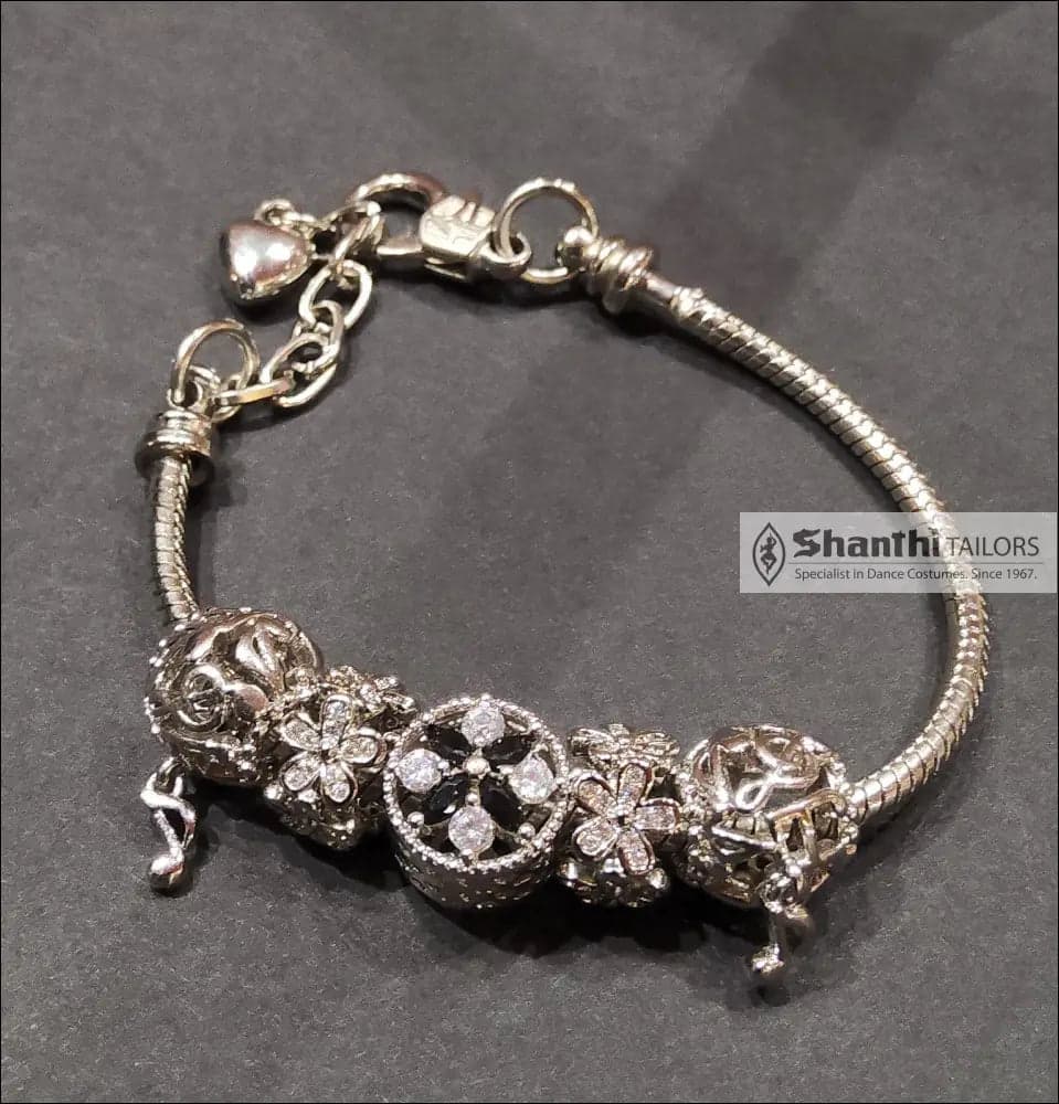 Silver Bloom Bracelet: Close-up of the clasp and silver chain, elegant floral charm bracelet.